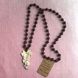 Carved fossil necklace